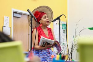 Pascale Millien of Sosyete Koukouy reads to attendees at last year’s Little Haiti Book Festival. (Photo courtesy of Miami Dade College/ Miami Book Fair)